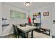 Inviting dining room featuring a sleek table, minimalist decor, and functional storage at 830 Bonnie Glen Se Dr, Marietta, GA 30067