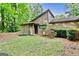 Beautiful home with a well-manicured lawn and lush greenery creating a serene setting at 830 Bonnie Glen Se Dr, Marietta, GA 30067