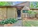 Inviting front entrance with a stone accent wall and well-maintained landscaping adding curb appeal at 830 Bonnie Glen Se Dr, Marietta, GA 30067