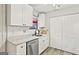 Updated kitchen with white cabinets, subway tile backsplash, and stainless steel dishwasher at 830 Bonnie Glen Se Dr, Marietta, GA 30067