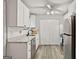 Bright kitchen featuring white cabinetry, stainless steel appliances, and modern countertops at 830 Bonnie Glen Se Dr, Marietta, GA 30067