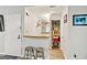 Convenient kitchenette area with bar seating, open shelving, and easy access to the doorway at 830 Bonnie Glen Se Dr, Marietta, GA 30067