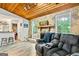 Relaxing living room with a stone fireplace and comfortable reclining seating area at 830 Bonnie Glen Se Dr, Marietta, GA 30067
