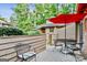 Outdoor patio space with a table, chairs, and an umbrella offering a nice outdoor sitting area at 830 Bonnie Glen Se Dr, Marietta, GA 30067