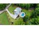 Aerial view showcasing the backyard oasis, in-ground pool, and long driveway at 2101 Thomas Rd, Canton, GA 30115