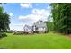 Expansive backyard with lush green lawn and patio, perfect for outdoor entertaining and relaxation at 2101 Thomas Rd, Canton, GA 30115