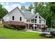 Expansive backyard featuring a large deck, pool, lush greenery, and plenty of space for outdoor activities at 2101 Thomas Rd, Canton, GA 30115