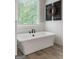Inviting bathroom showcases a luxurious soaking tub with stylish fixtures and finishes at 2101 Thomas Rd, Canton, GA 30115