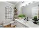 Stylish bathroom featuring a white vanity, decorative mirror, and modern fixtures at 2101 Thomas Rd, Canton, GA 30115