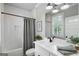 Elegant bathroom with white subway tile, dark fixtures, and a framed mirror exudes modern charm at 2101 Thomas Rd, Canton, GA 30115