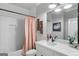 Stylish bathroom with a shower-tub combo, white subway tile, and elegant fixtures create a clean aesthetic at 2101 Thomas Rd, Canton, GA 30115
