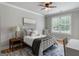 Bright bedroom with a large window, hardwood floors, and neutral decor creates a peaceful retreat at 2101 Thomas Rd, Canton, GA 30115