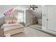 Cozy bedroom features neutral tones, a charming window, and a unique elevated platform at 2101 Thomas Rd, Canton, GA 30115