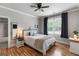 Bright bedroom with hardwood floors, large window, and ensuite bathroom boasts ample natural light at 2101 Thomas Rd, Canton, GA 30115