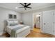 Inviting bedroom with hardwood floors, ensuite bathroom, and ample natural light offers a comfortable space at 2101 Thomas Rd, Canton, GA 30115