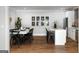 Bright dining room with a long table, black chairs, and elegant decor, creating an inviting space for gatherings at 2101 Thomas Rd, Canton, GA 30115