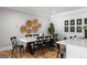 Dining room with black chairs and decorative wall art, adjacent to a bright kitchen area at 2101 Thomas Rd, Canton, GA 30115