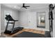 Bright exercise room with a treadmill and large mirror, promoting a healthy lifestyle at 2101 Thomas Rd, Canton, GA 30115