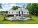 Lovely exterior showcasing a pool and sprawling lawn surrounded by lush greenery at 2101 Thomas Rd, Canton, GA 30115