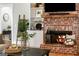Close-up of the living room's brick fireplace, built-in shelves, and mantle at 2101 Thomas Rd, Canton, GA 30115