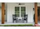 Inviting front porch featuring rocking chairs and wood columns at 2101 Thomas Rd, Canton, GA 30115