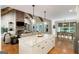 Open concept kitchen, with brick fireplace, breakfast area, and dining room at 2101 Thomas Rd, Canton, GA 30115