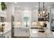 Bright kitchen featuring white cabinets, subway tile backsplash and farmhouse sink at 2101 Thomas Rd, Canton, GA 30115