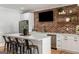 Stylish kitchen area with brick wall, stainless steel appliances, and seating, ideal for entertaining at 2101 Thomas Rd, Canton, GA 30115