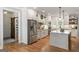 Kitchen featuring stainless steel appliances, island, and barn door pantry at 2101 Thomas Rd, Canton, GA 30115