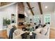 Comfortable living room with a brick fireplace, built-in shelving, and lots of natural light at 2101 Thomas Rd, Canton, GA 30115