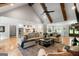 Spacious living room with exposed beam ceiling open to kitchen featuring stainless steel appliances at 2101 Thomas Rd, Canton, GA 30115