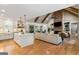Open concept living space with a kitchen, brick fireplace, vaulted ceiling and exposed beams at 2101 Thomas Rd, Canton, GA 30115