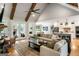 Open living area featuring a fireplace, vaulted ceiling, and access to the kitchen at 2101 Thomas Rd, Canton, GA 30115