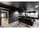 Home theater room with sleek black finishes and comfortable seating, perfect for movie nights at 2101 Thomas Rd, Canton, GA 30115