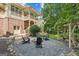 Cozy backyard fire pit area with Adirondack chairs and an upper level deck at 3088 Hidden Falls Dr, Buford, GA 30519