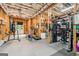 Unfinished basement featuring an in-home gym, doorway to the exterior, and exposed ceiling at 3088 Hidden Falls Dr, Buford, GA 30519
