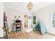 Bedroom with desk area, bright windows, light hardwood floors and decorative teepee at 3088 Hidden Falls Dr, Buford, GA 30519
