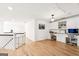 Bonus room featuring hardwood floors, white walls, and built-in desks and shelving at 3088 Hidden Falls Dr, Buford, GA 30519