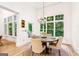 Cozy dining area with hardwood floors and large windows providing scenic views at 3088 Hidden Falls Dr, Buford, GA 30519