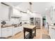 Well-equipped kitchen featuring white cabinets, stainless steel appliances, and a central island at 3088 Hidden Falls Dr, Buford, GA 30519