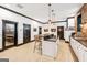 Modern kitchenette with countertop seating, sleek cabinetry, and an open floor plan design at 3088 Hidden Falls Dr, Buford, GA 30519