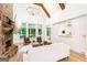 Open living room with stone fireplace, vaulted ceilings and hardwood floors at 3088 Hidden Falls Dr, Buford, GA 30519