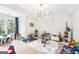 Bright and spacious playroom filled with toys and natural light, perfect for activities at 3088 Hidden Falls Dr, Buford, GA 30519