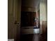 Bathroom with a tub, partial walls and a fan blowing at 372 Nalley Dr, Stone Mountain, GA 30087