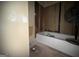 Bathroom with a tub, exposed walls, and needed repairs for renovation at 372 Nalley Dr, Stone Mountain, GA 30087