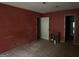 Bedroom with a door, window overlooking backyard, and hardwood floors at 372 Nalley Dr, Stone Mountain, GA 30087
