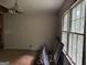 Bedroom with natural light, hardwood flooring, and damaged walls in need of repair at 372 Nalley Dr, Stone Mountain, GA 30087