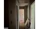 A hallway showcasing doorways and wood floors leading to other rooms at 372 Nalley Dr, Stone Mountain, GA 30087