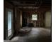 Living room with exposed studs and ceilings, featuring a doorway to the outside at 372 Nalley Dr, Stone Mountain, GA 30087