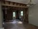 Living room with exposed studs, hardwood flooring, and natural light at 372 Nalley Dr, Stone Mountain, GA 30087